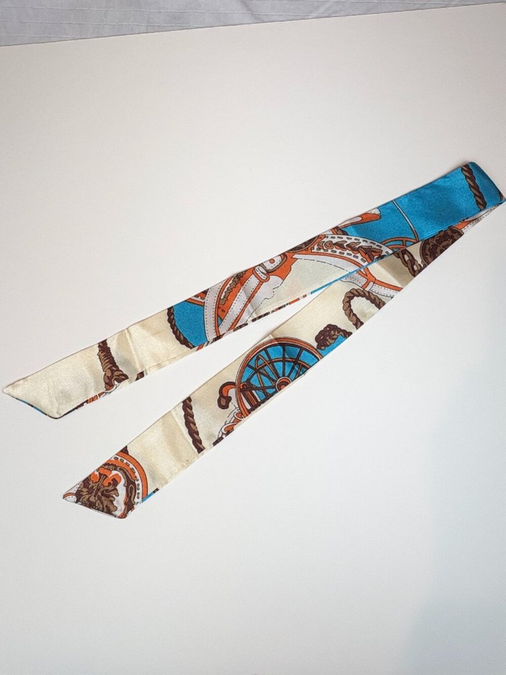 Elegant cream, blue and burnt orange terracotta graphics skinny satin scarf. New